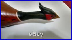 # 1. Pheasant solid wood carving by big sky carvers vintage hindley collection